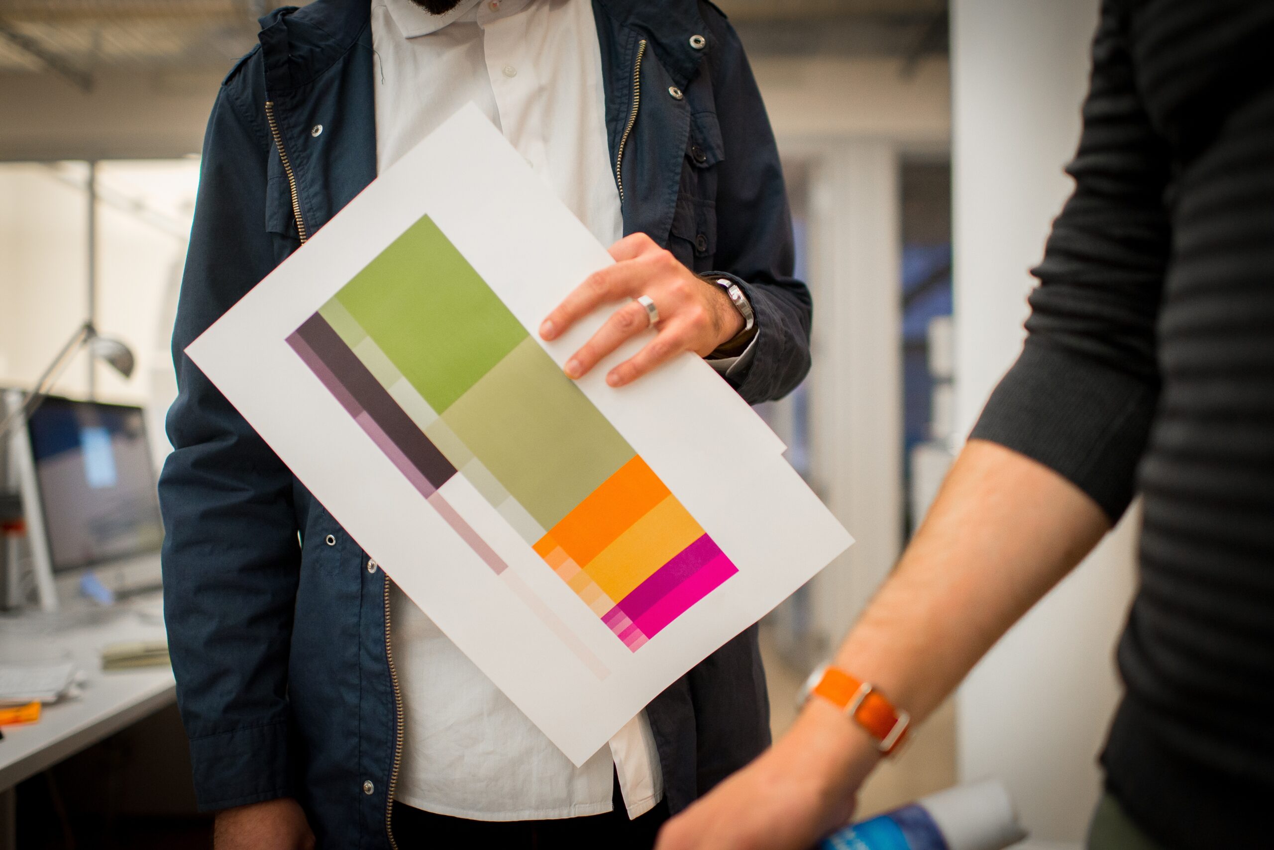 designer critique with printout on the desk