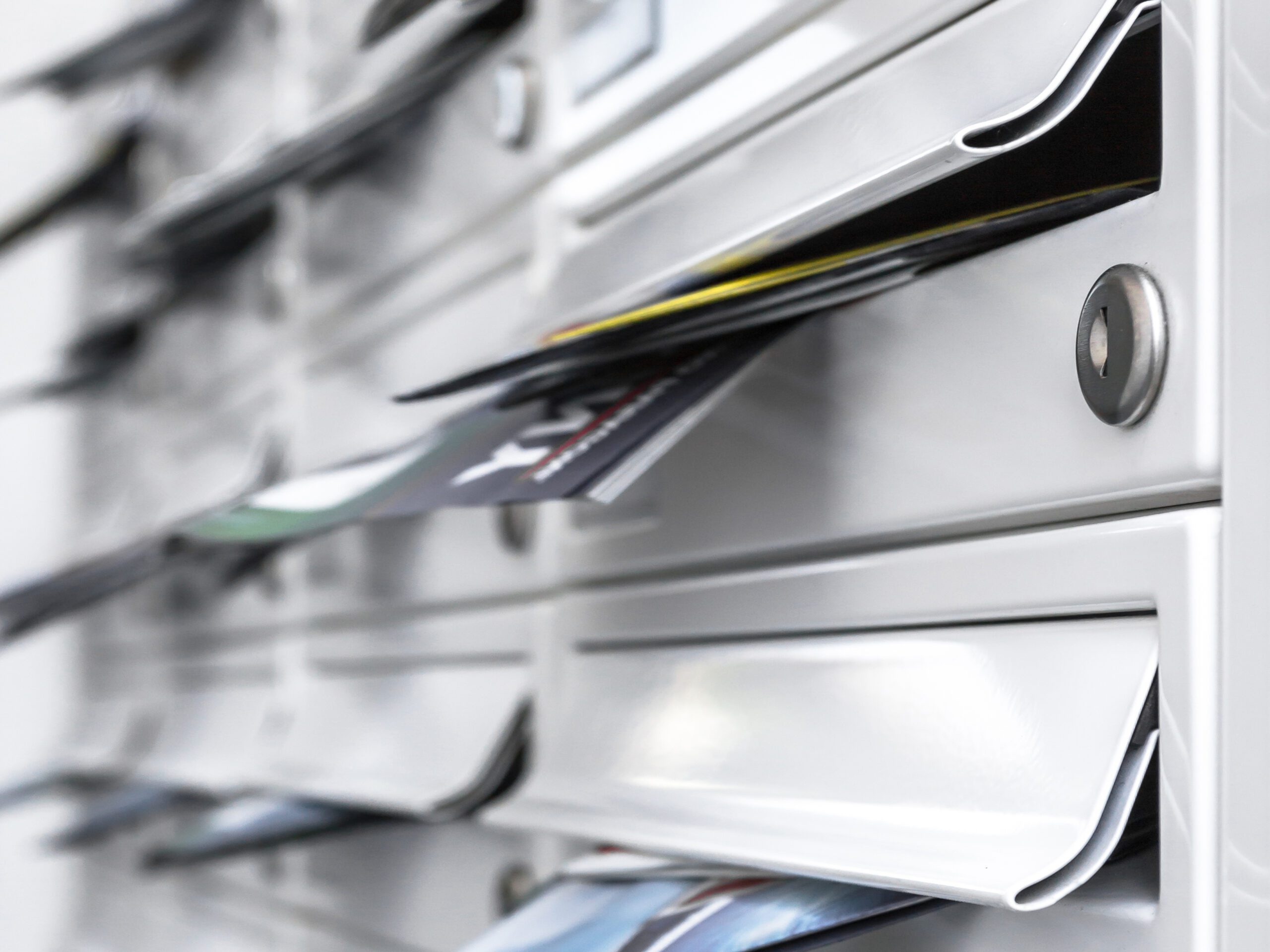 Direct Mail modern mailboxes filled of leaflets