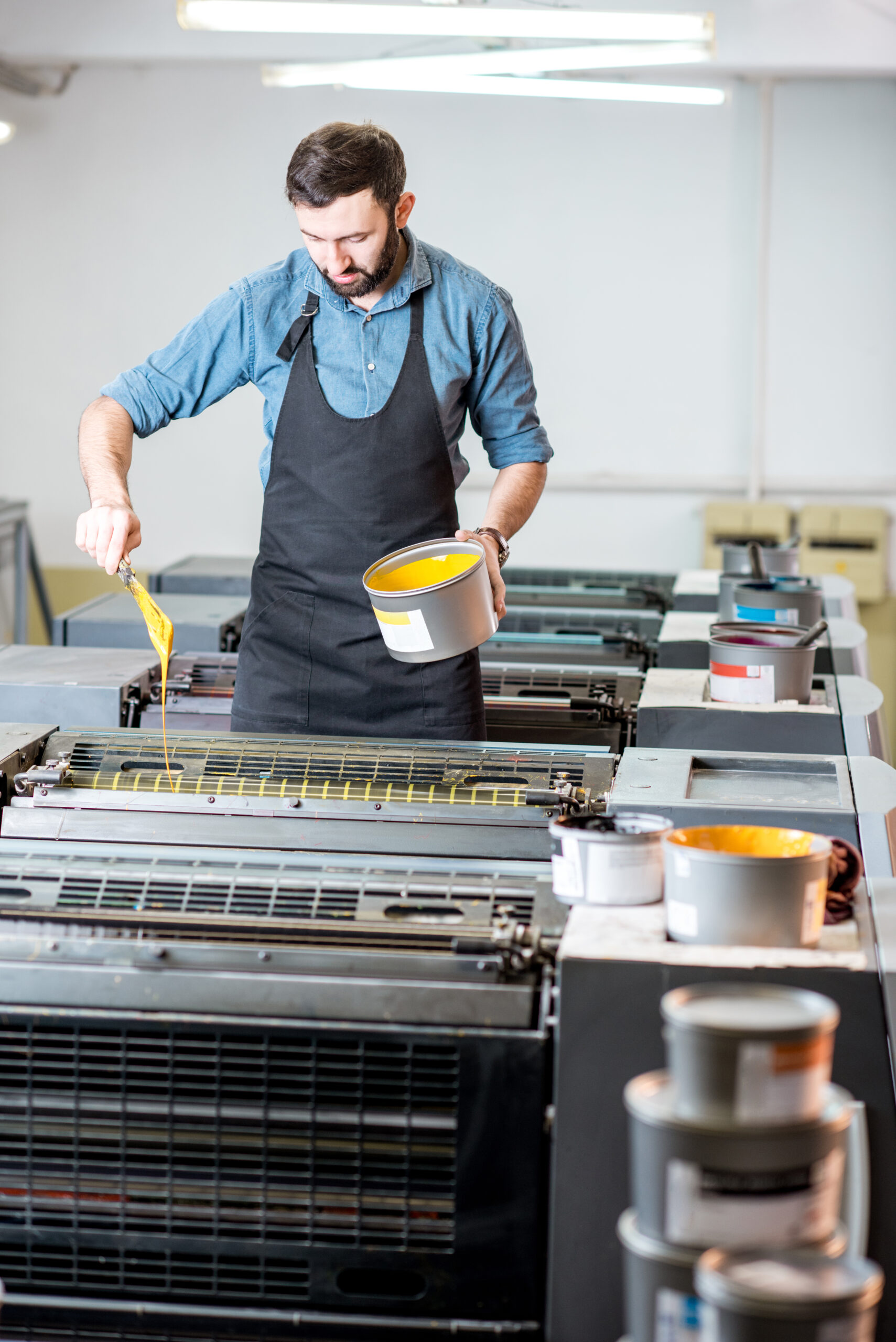 typographer with paint at the manufacturing